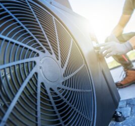 Engineer servicing a rooftop air conditioning unit